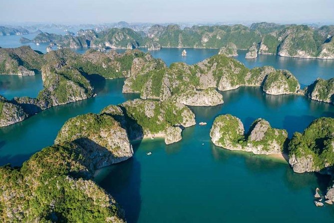 1 Day Boat Tour: HaLong Bay, Lan Ha Bay, Natural Beach and Full Moon Party - Bright Cave and Dark Cave Kayaking: The Main Event