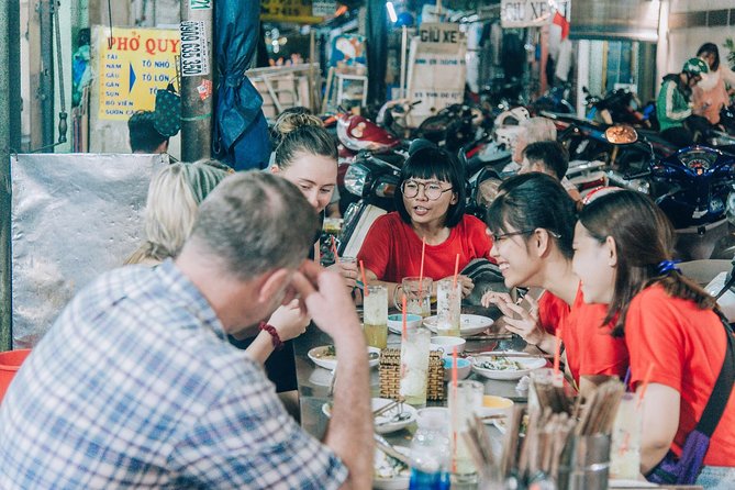 12 Tasting Street Food & Sightseeing By Scooter with Student - Guides, English, and the Student Perspective