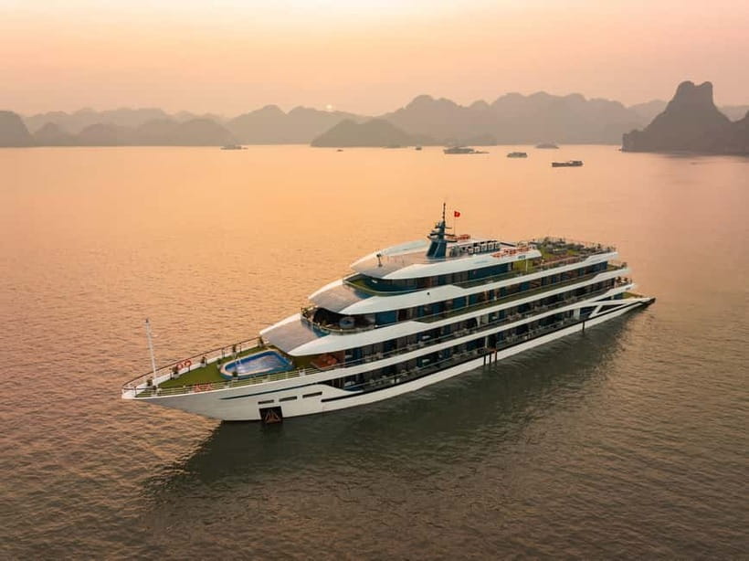 2-Day or 3-Day: Halong&Lan Ha Bay Cruise 5<em> balcony,bathtub – Key things to know before you go’ /></p>
<ul>
<li><strong>Balcony + bathtub</strong> cabins make the overnight part feel genuinely comfortable, not just functional.</li>
<li>You’ll do a mix of <strong>active time (kayak, bike, swimming)</strong> and lighter options like a <strong>Jacuzzi</strong> when conditions aren’t perfect.</li>
<li>Expect at least one big “wow” moment: <strong>Dark & Bright Cave</strong> via kayak or a bamboo boat rowed by locals.</li>
<li>The cruise includes set activities like <strong>sunset parties, squid fishing, karaoke, and dancing</strong>, so your evenings stay filled.</li>
<li>Transfers can make or break the first impression, especially if traffic forces schedule changes.</li>
</ul>
<h2 id="doria-5-cabins-balcony-bathtub-and-real-downtime">Doria 5</em> cabins: balcony, bathtub, and real downtime</h2>
<p><img width="820" height="615" decoding="async" src=