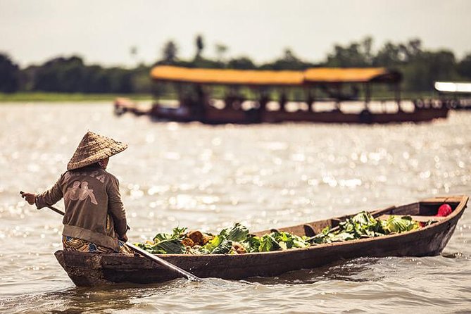 Authentic Mekong Delta Floating Market Full Day: Private or Group - The lunch setup: tropical fruit, southern folk music, and real Delta flavors