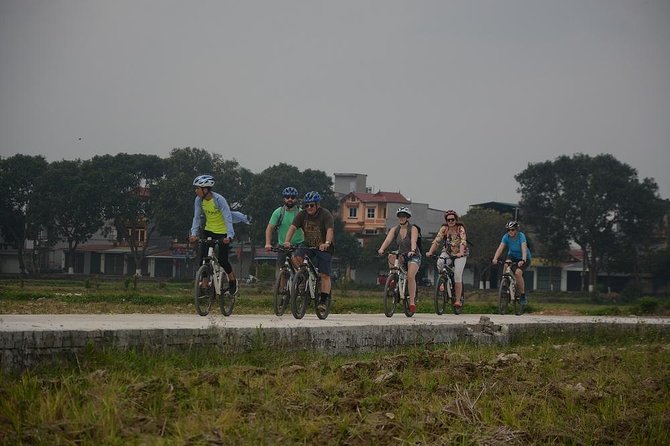 Bicycle Tours Hanoi: Full Day Bicycle Tours City & Countryside - Cổ Loa Citadel, wet-market fruit, and a lotus-lake pause