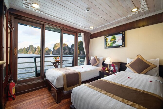 BOUTIQUE CRUISES Halong Bay 2 Days,1 Night Tour: Swimming,Caving, and Kayaking - Day 2: breakfast, photos, then Tuan Chau and back to Hanoi