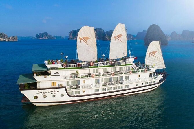 Charming Cruise 2-day Explore Halong Bay from Hanoi - Dark and Light Cave: kayaking or bamboo boat on calm water