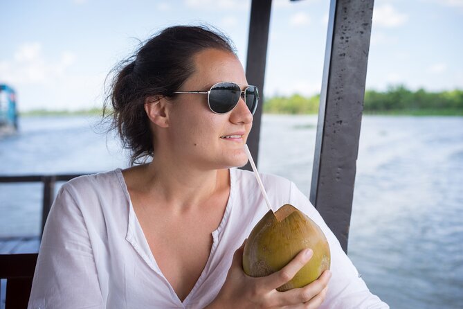 Cu Chi Tunnels and Mekong Delta 1 Day Tour from Ho Chi Minh City - Sampan canals, coconut sweets, and rice paper-making