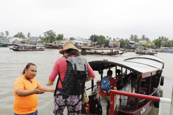 Cu Chi Tunnels - Cao Dai Temple & Black Virgin Mountain Full Day - Mekong-style village time: bicycles, boats, fruit, and that Cai Be moment