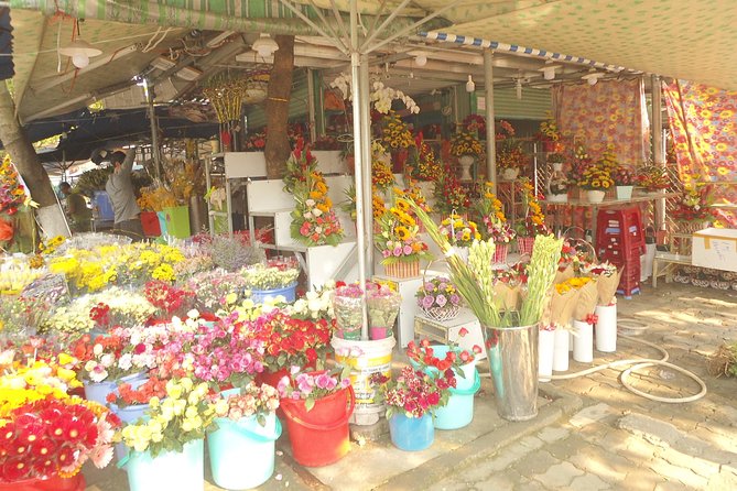 Da Nang Night Motorbike Tour & River Cruise Riding By Lady Rider - Sun Wheel and the Night Market: Photo Time Meets Real Street Vibes