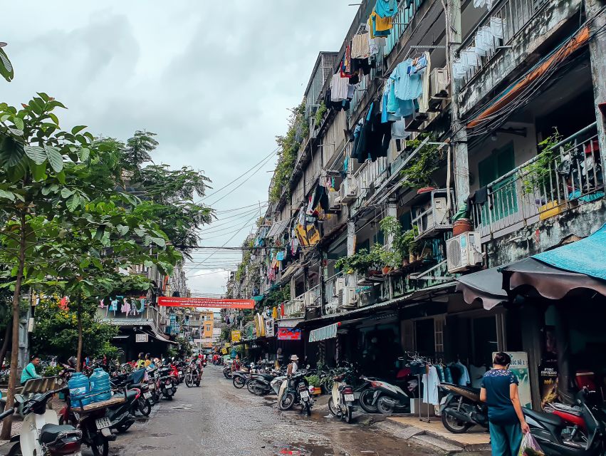 Discover Saigon's Local Sites and Culture by Motorbike - District 3 old apartments: seeing daily life up close