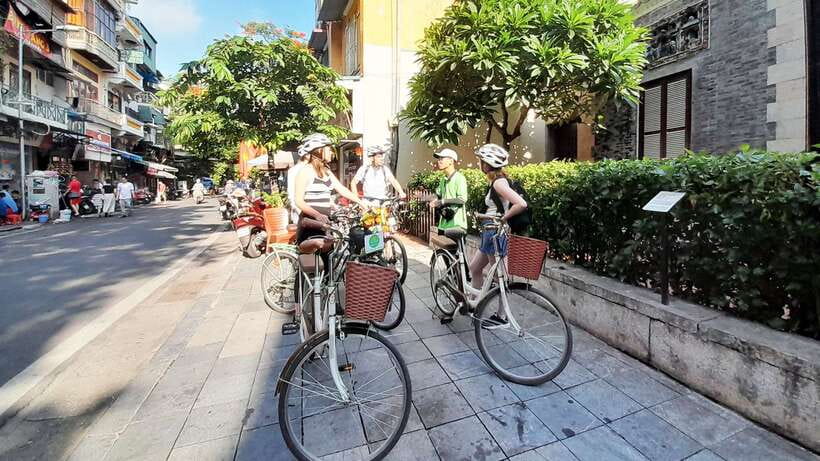 Explore Hanoi Old City By Cycling Tour With Small Groups - Crossing to the delta: Long Bien Bridge and the banana-green break