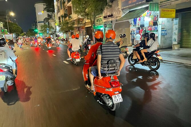 Female Riders Vespa Night Street Food + Train Street food 4 Hours - Stop 3 to Long Bien: ceramic road, Chuong Duong Bridge, and a night-city glimpse