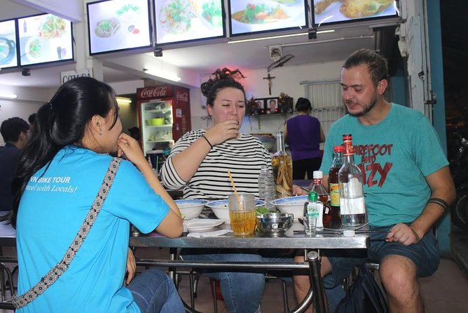 Food Tour by motorbike with local students - Seeing Saigon in motion: riding through districts without a classroom vibe