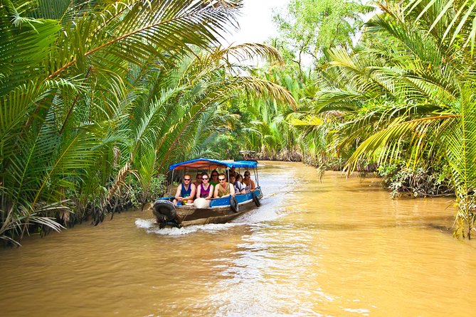From HCM City: Mekong Delta Tour with Sampan Journey - Riding Out to My Tho: Rice Fields, AC Comfort, and Road Reality