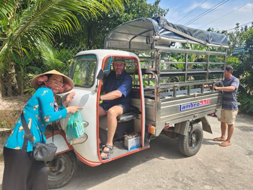 From Ho Chi Minh: Explore Mekong Delta & Vinh Trang Pagoda - Mekong Delta boat scenes: fishing boats, river light, and “mother of the river”