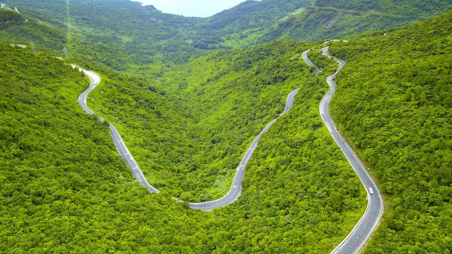 From Hue: Hoi An Guided Bus Tour with 4 Sightseeing Stops - Stop 4: Marble Mountains Caves, Temples, and Panoramic Views