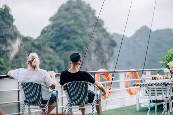 Full-Day Halong Bay Cruise with Limousine Pickup - Hang Luon Cave area: kayaking or the rowboat choice