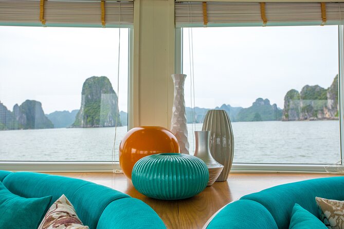 Ha Long Bay Day Tour with Lunch, Kayak, Cave explore - Watching the karsts glide by (Cock Fighting Island, Incense Island, and more)