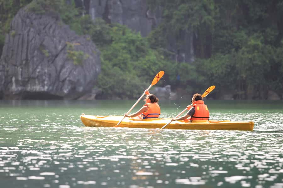 Halong Bay: Day Cruise with Caves, Kayaking & Sunset Party - Titop Island: Swim, Photos, Coffee, and the Summit Hike