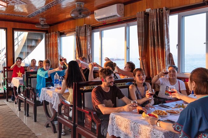 Halong Bay Day Tour With Titop Island, Cave, Kayak & Lunch - Hang Luon Cave Area: Kayak or Bamboo Boat Time on the Water