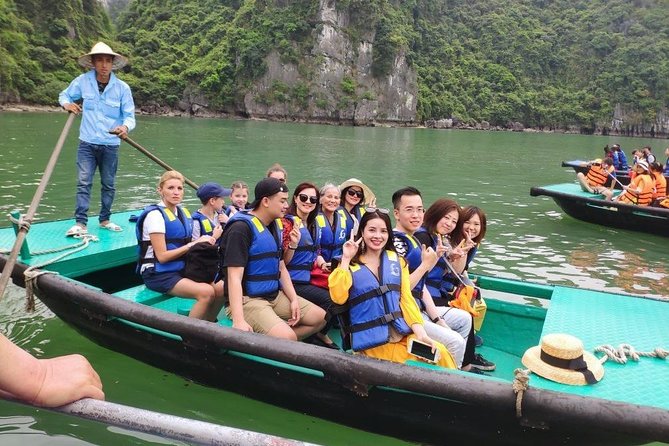 Halong Bay Day Tour With Titop Island, Cave, Kayak & Lunch - Sunset party at sea: fruit, cake, and golden-hour photos