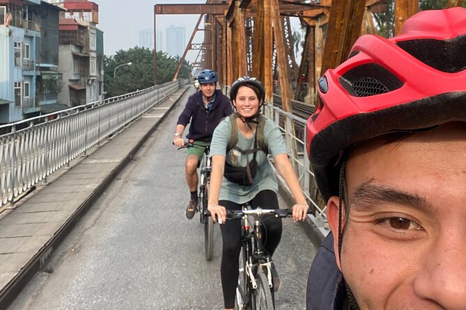 Hanoi City Bike Tour through Banana Island & Food Tasting - Long Bien Bridge: the first big wow shot