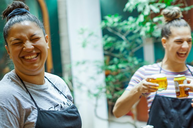 Hanoi Cooking Class in Hidden Villa with Free Pick-Up - Dinner table focus: herbal tea, fruit wine, and the meal you came for