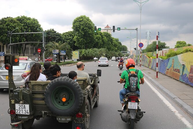 Hanoi Jeep City Tour combine Countryside Train Street, Hidden Gem - Ho Chi Minh Mausoleum, Temple of Literature, and Long Bien Bridge