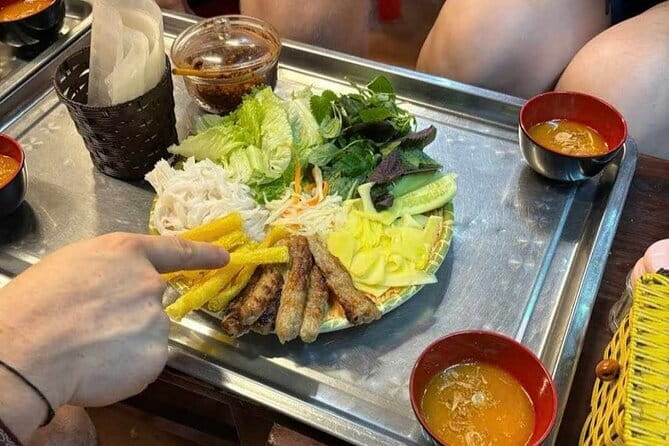 Hanoi Street Food Tour with egg coffee making - Stop 1 at Chua Lý Triệu Quốc Sư: Pho, Banh Mi, and Roll-Ups