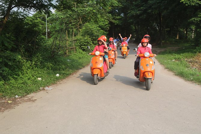 Hanoi Vespa Full Day City & Countryside with Female Ao Dai Riders - West Lake area: botanic gardens, Huu Hiep Lake, and the B-52 crash site