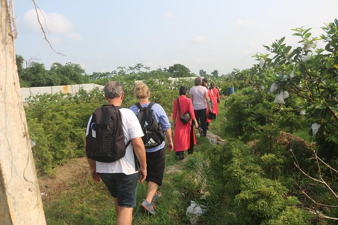 Hanoi Vespa Full Day City & Countryside with Female Ao Dai Riders - Duong Tau: riding near railway tracks where homes sit very close