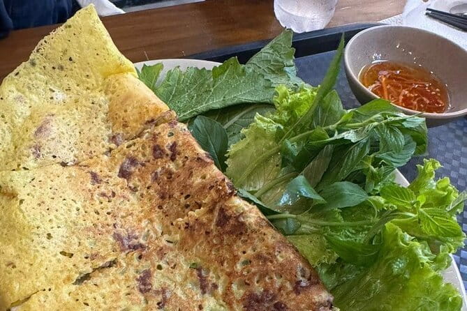 Ho Chi Minh City Food Tour with 8+ Authentic Local Tastings - Starting at Ben Nghe Street Food: a market-area launch that gets you moving