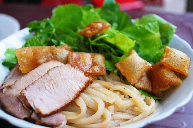 Hoi An Street Food Tour By Scooter - Stop 1: Hoi An Night Market for the first round of tastes
