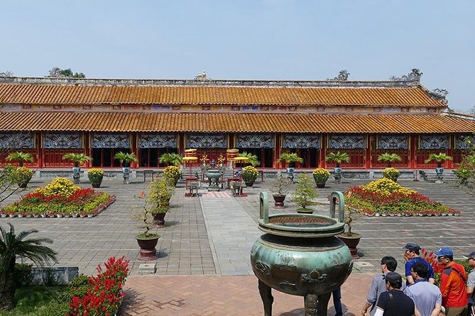 Hue Imperial City Daily Ingroup Tour via Hai Van Pass - Hue between monuments: spotting the Perfume River