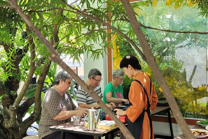 Hue's Vegetarian Cooking Class in Ancient Garden - The open-space art exhibition is part of the experience, not a side quest