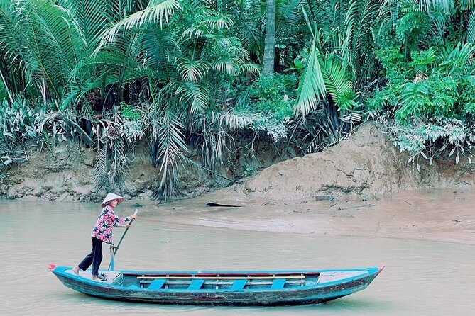 Mekong Delta Guided Tour from Ho Chi Minh City - Into the canals by rowing boat: footbridges, shade, and slow maneuvering