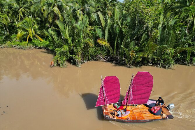 Mekong River Relaxing Sail boat cruise to Coconut Canals (1.5HRS) - Sunset on a Swaying Coconut Tree: The Moment People Remember