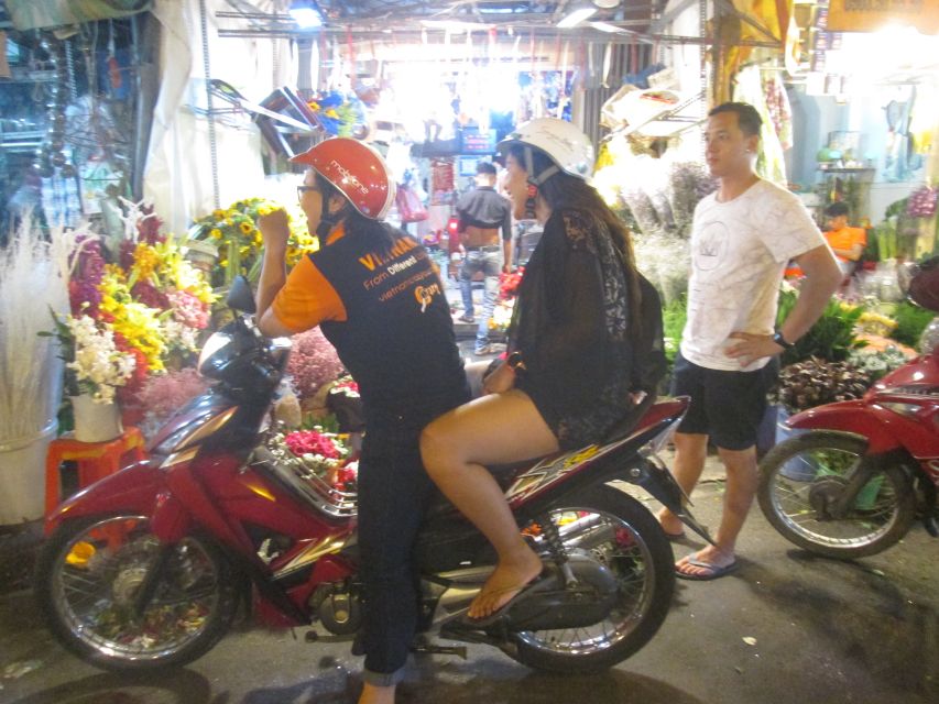 Midnight Street Food Tour In Saigon By Motorbike - River Tunnels to Luxury Views: Your First 10 Minutes Set the Tone
