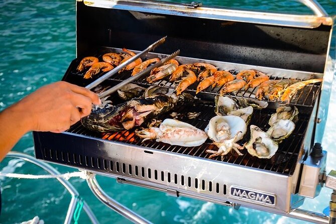 Nha Trang Private Sailing Cruise Tour - Getting aboard: champagne, fruit, and a city-facing sunset plan