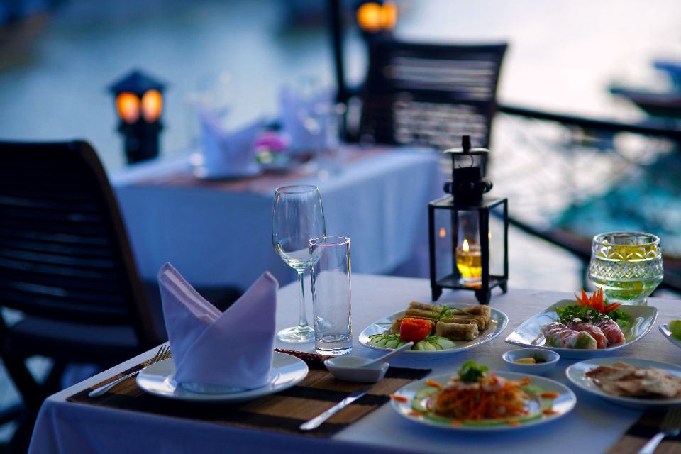 Romantic Sunset Dinner Cruise in Hoi An - Dinner on the Water: Seafood, Wine Options, and Tropical Fruit Dessert