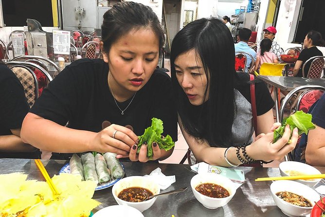 Saigon Afternoon Unseen Street Food by Scooter |Opt: Ao Dai Rider - Stop-by-stop: coffee bunker, flowers, and District 4 food