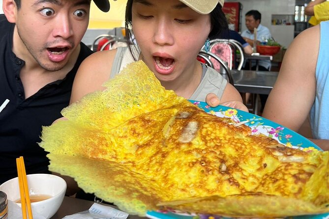 Saigon Food Tour by Scooter with Eleven Tastings - Ho Thi Ky Flower Market and the Grilled Rice-Paper Food-Fight