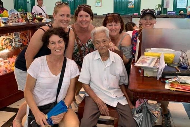 Saigon Historical City Tour - Meeting your guide: motorbike pickup, helmets, and pacing