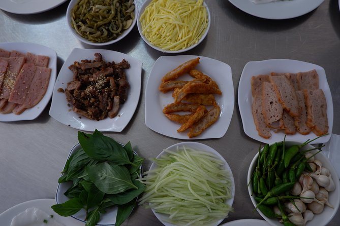 Saigon luxury food tour on motorbike with 10 authentic dishes - Ho Thi Ky Flower Market at dusk: your first taste of local life