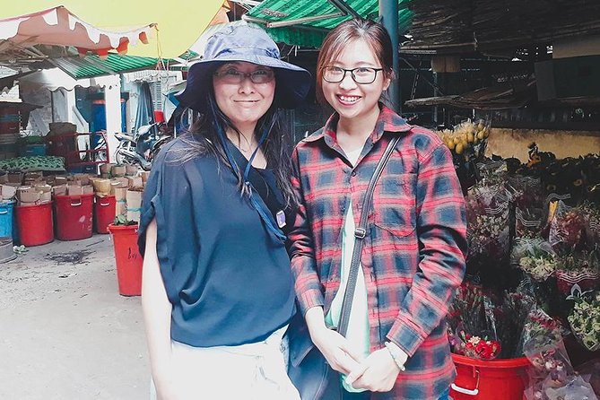 Saigon Night Sights & Local Food by Motorbike| Opt: Ao Dai Riders - Helmet, poncho, and real traffic safety basics