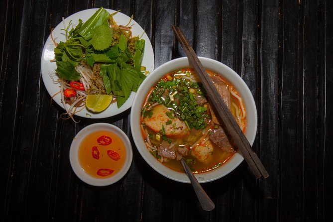 Saigon Night Street Food and City Tour on Scooter - Noodle soup stop: Bun Bo Hue, Banh Canh, or Mien Ga