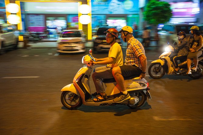 Saigon Night Street Food and City Tour on Scooter - The short ride between stops: see Saigon after the dishes