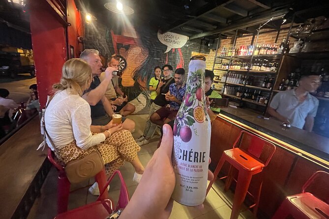 Saigon Night Street Food and Craft Beer Tour by Vespa Scooter - Guides and scooter comfort: helmet, rain gear, and street smarts
