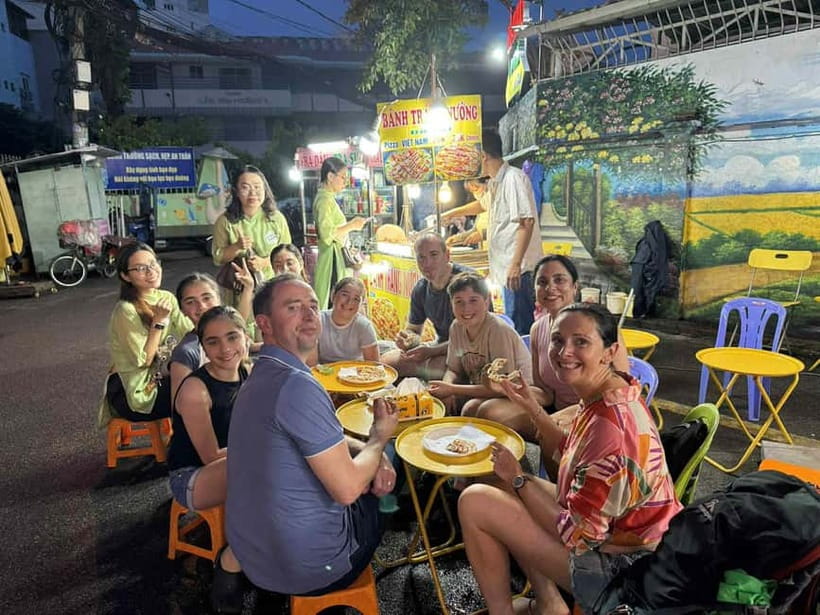 Saigon: Street Food Evening Walking Tour - Night market starters: tropical fruit, snake wine, and banh mi
