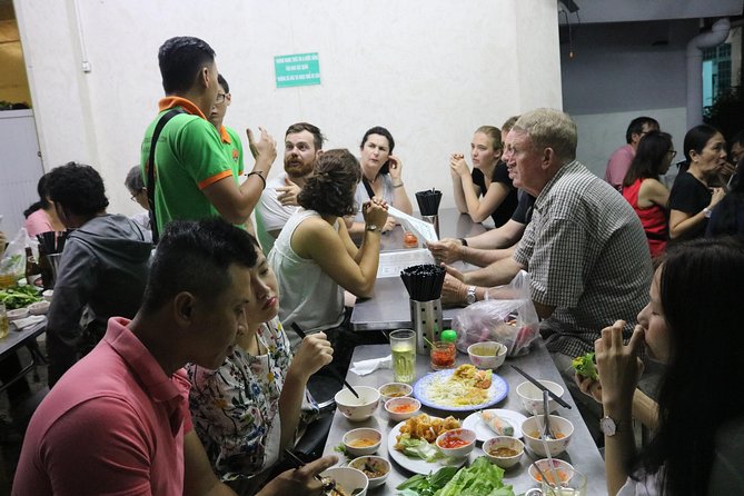 Saigon Vespa By Night Street Food Tour 4,5 Hours - Two restaurant stops with all food and drink included