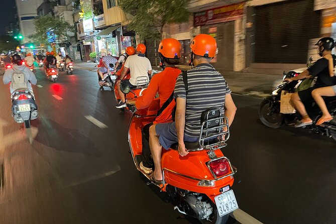 Saigon Vespa By Night Street Food With Female Riders Ao Dai - Stop One: seafood street-food tastings that set the tone fast