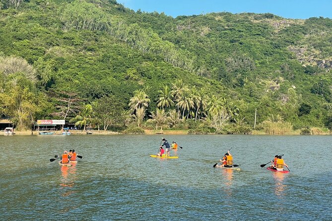 Stand Up Paddle Boarding and Sunset Watching on Cai River - Cruising the Song Cai River: Calm Water, Local Surroundings