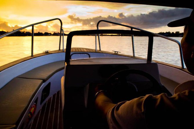 Sunset cruise and Saigon by night tour - Cruising Saigon River at sunset and reaching the Go Vap floating temple